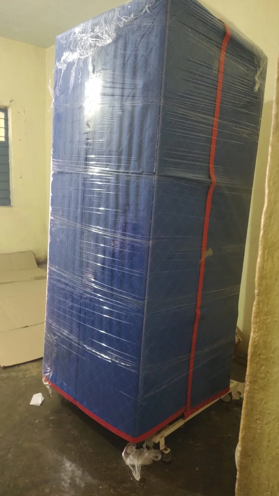 Fridge in safety matt and bubble wrap